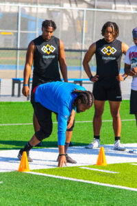 Coach demonstrating combine technique